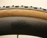 The 303's wider rim provides extra gluing surface area and almost covers the entire base tape.  Cyclocross Magazine