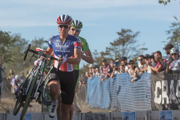 Powers chased by Trebon through the barriers. Photo by Todd Prekaski