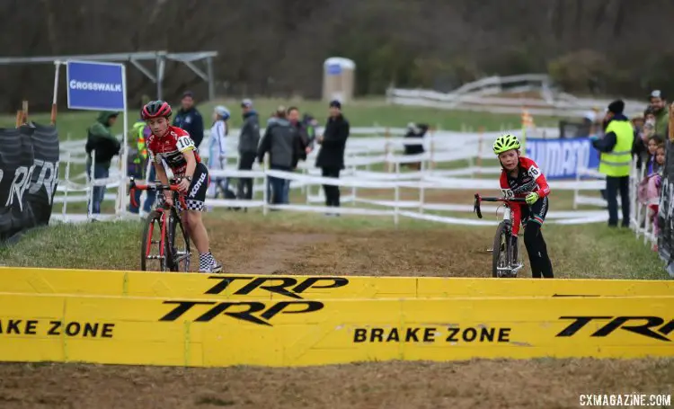 Last year's 9-10 champ Carden King (right) and Jack Spranger in sync over the barriers. Note King's downtube-grab dismount. Junior Men 11-12, 2016 Cyclocross National Championships. © Cyclocross Magazine