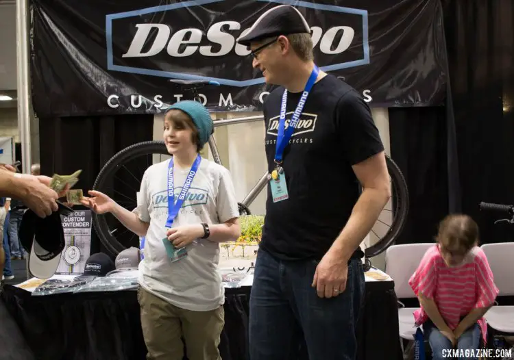 It's a family business at Desalvo Custom Cycles, as his son sells branded merchandise. NAHBS 2016. © Cyclocross Magazine