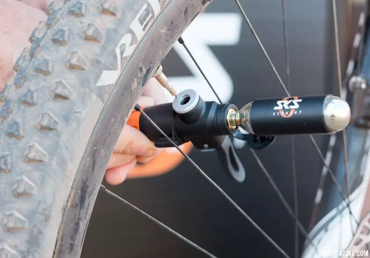 The new TL Pump head is SKS's new tubeless floor pump head that combines a Co2 inflato and floor pump. Use the Co2 cartridge for the initial burst, and then pump away to finish it off. Magura Press Camp. © Cyclocross Magazine
