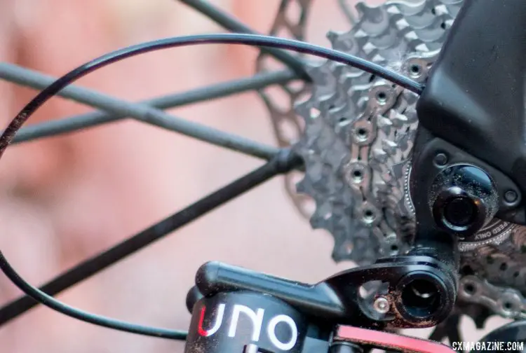 Rotor's Uno hydraulic rear derailleur has an exposed loop of hydraulic hose that appears to be a bit vulnerable to damage, and the hose may expand more than it should during slow shifting. © Cyclocross Magazine
