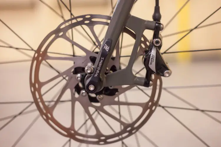 12mm thru-axles on both ends and a minimum rotor size of 180mm show that the RAVN doesn’t intend to back down when the route gets hairy. © Cyclocross Magazine