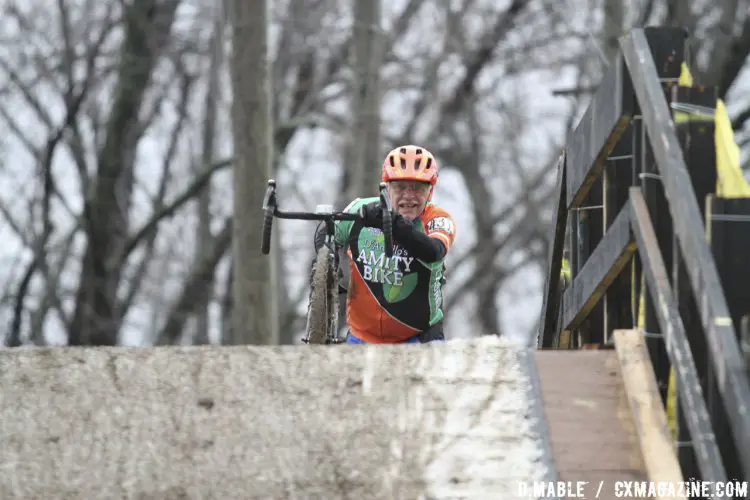 Curtiss Burwell of New Haven, Conn. crests the top of the flyover in the Masters 65-69 Championship race. 2017 Cyclocross National Championships. ©D. Mable/Cyclocross Magazine