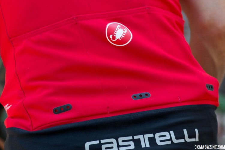 Laser cut drain holes on the Gabba3 pockets allow water to drain. The reflective Castelli logo is on the drop tail that helps keep you back end dryer and warmer. Castelli Cycling. © Cyclocross Magazine