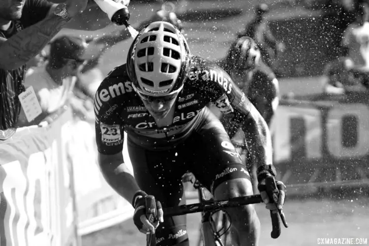 Stan Godrie (Crelan-Charles) gets a cold shower during his race. 2017 World Cup Waterloo Elite Men. © D. Mable / Cyclocross Magazine