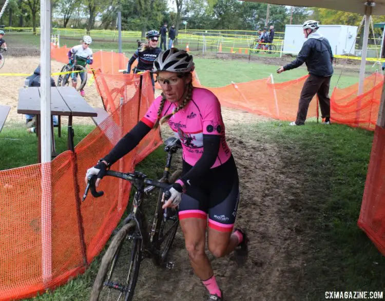 Julie Phelps heads through the beer tent after the sand pit. 2017 Fitcherona Cross Omnium - McGaw Park. © Z. Schuster / Cyclocross Magazine