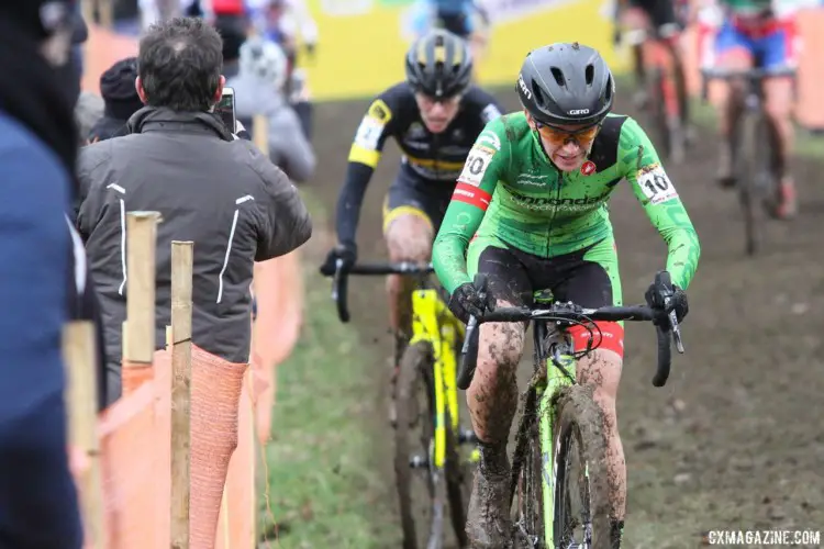 Kaitie Keough focuses ahead while a fan tries to get a photo of Ellen Van Loy behind her. 2018 Telenet UCI World Cup Nommay. © B. Hazen / Cyclocross Magazine