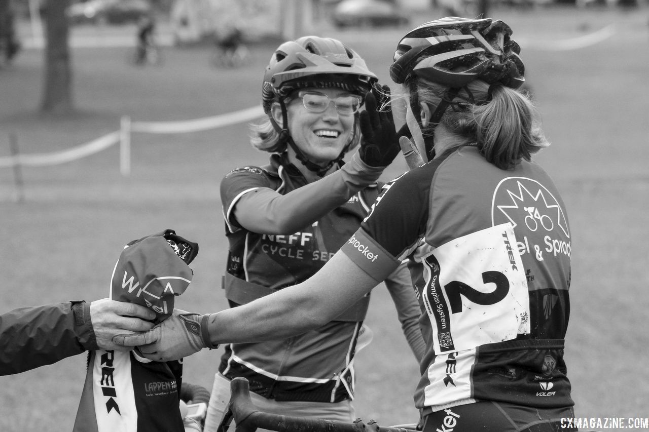 1-2 finishers Holly LaVesser and Emily Nordahl share a high five. 2018 Cross Fire, Sun Prairie, Wisconsin. © Z. Schuster / Cyclocross Magazine