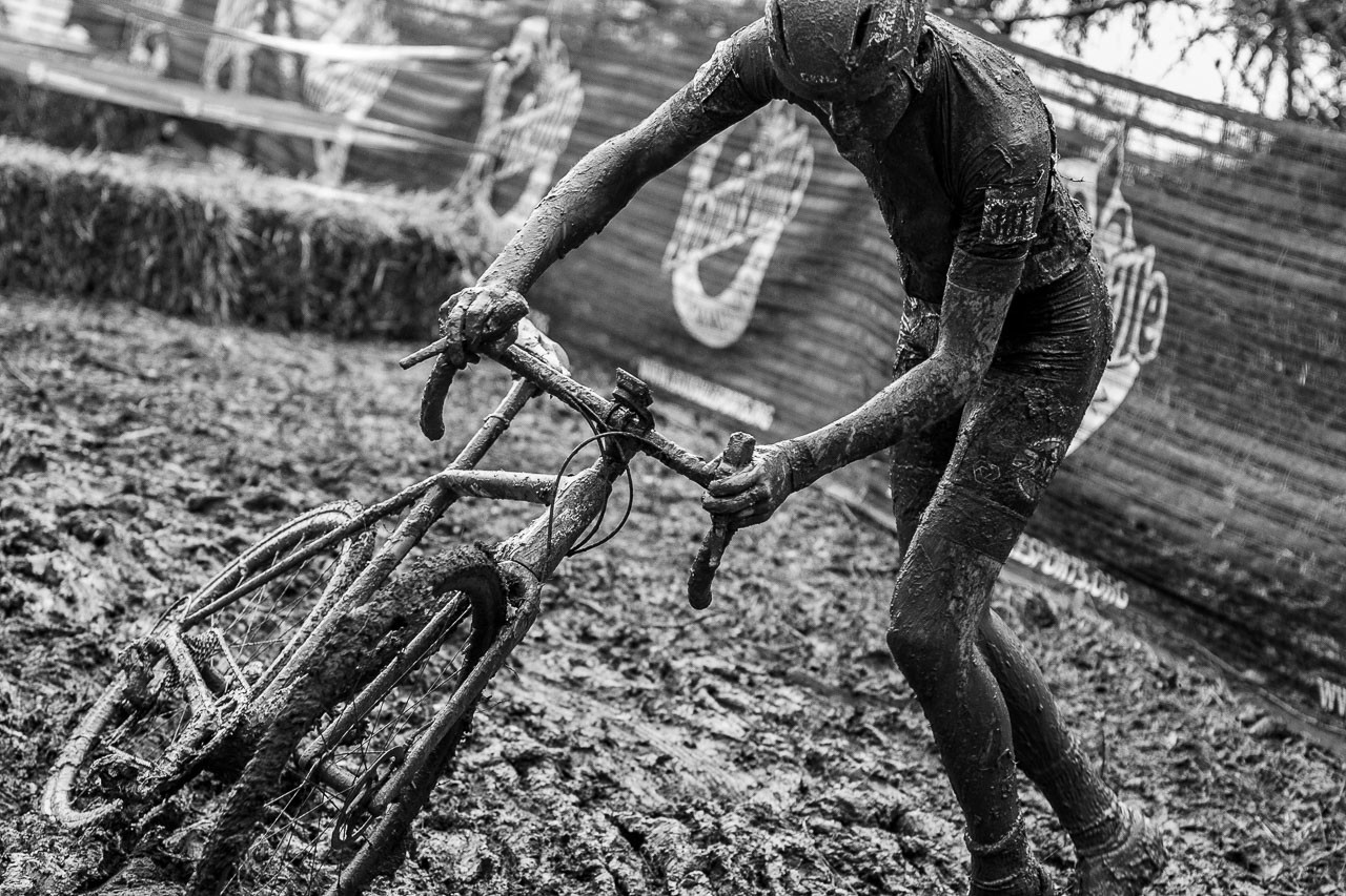 David Sandoval pushed his bike into the 180-degree turn. Deep ruts made riding it cleanly a challenge. Junior Men 15-16. 2018 Cyclocross National Championships, Louisville, KY. © A. Yee / Cyclocross Magazine
