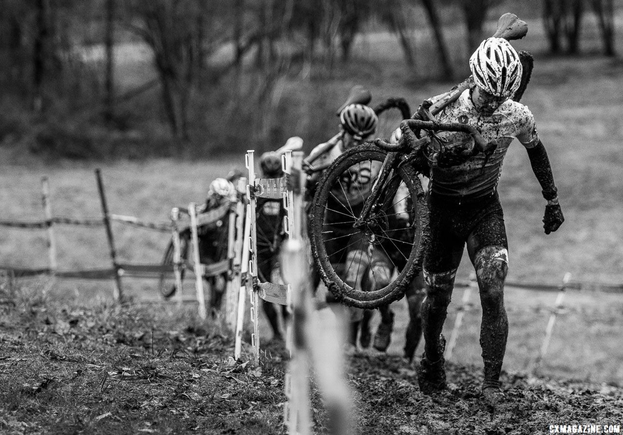 As mud began to cling to bikes, riders shouldered them in an effort to keep them as clean as possible. Singlespeed Men. 2018 Cyclocross National Championships, Louisville, KY. © A. Yee / Cyclocross Magazine