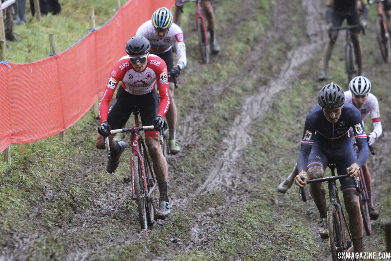 Gunnar Holmgren leads Gage Hecht through the rutted off-camber early in the race. 2018 World Cup Namur. © B. Hazen / Cyclocross Magazine