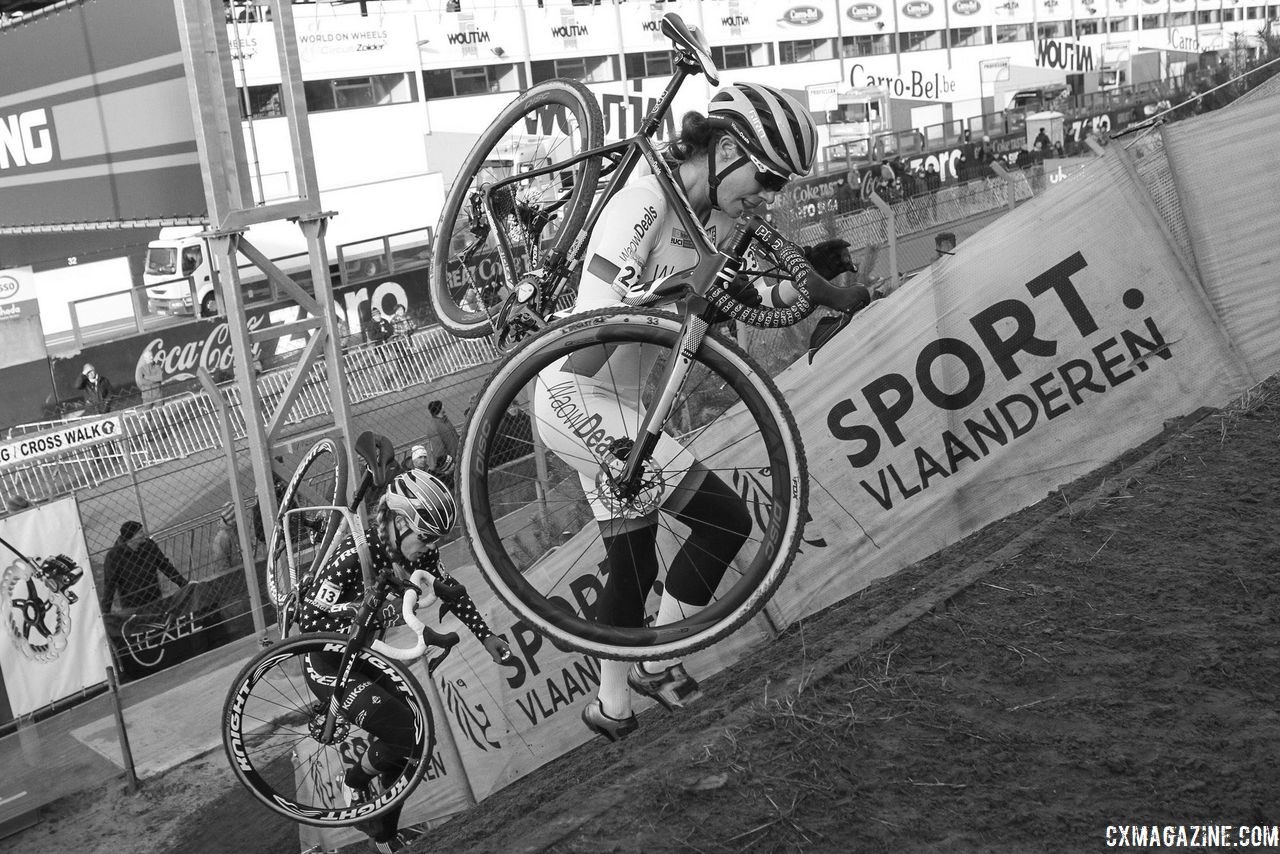 Marianne Vos and Katie Compton head up the run-up after Vos' mechanical. 2018 World Cup Heusden-Zolder. © B. Hazen / Cyclocross Magazine