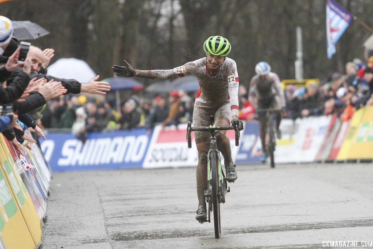 Fans give Marianne Vos high fives after her second-place ride. 2018 World Cup Namur. © B. Hazen / Cyclocross Magazine