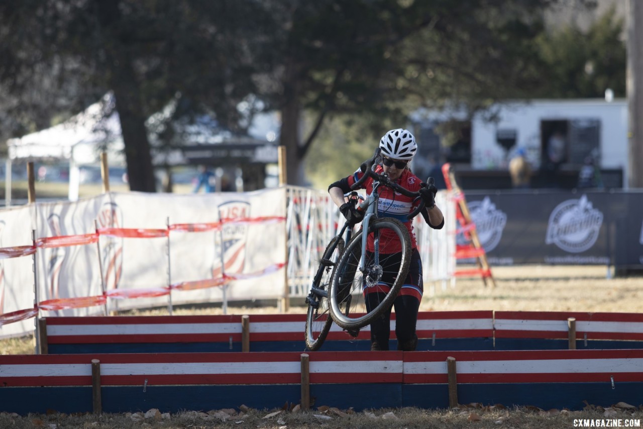 Mary Geralts runs the barriers. Masters Women 60-64, 65-69, 70-74, 75+. 2018 Cyclocross National Championships, Louisville, KY. © A. Yee / Cyclocross Magazine