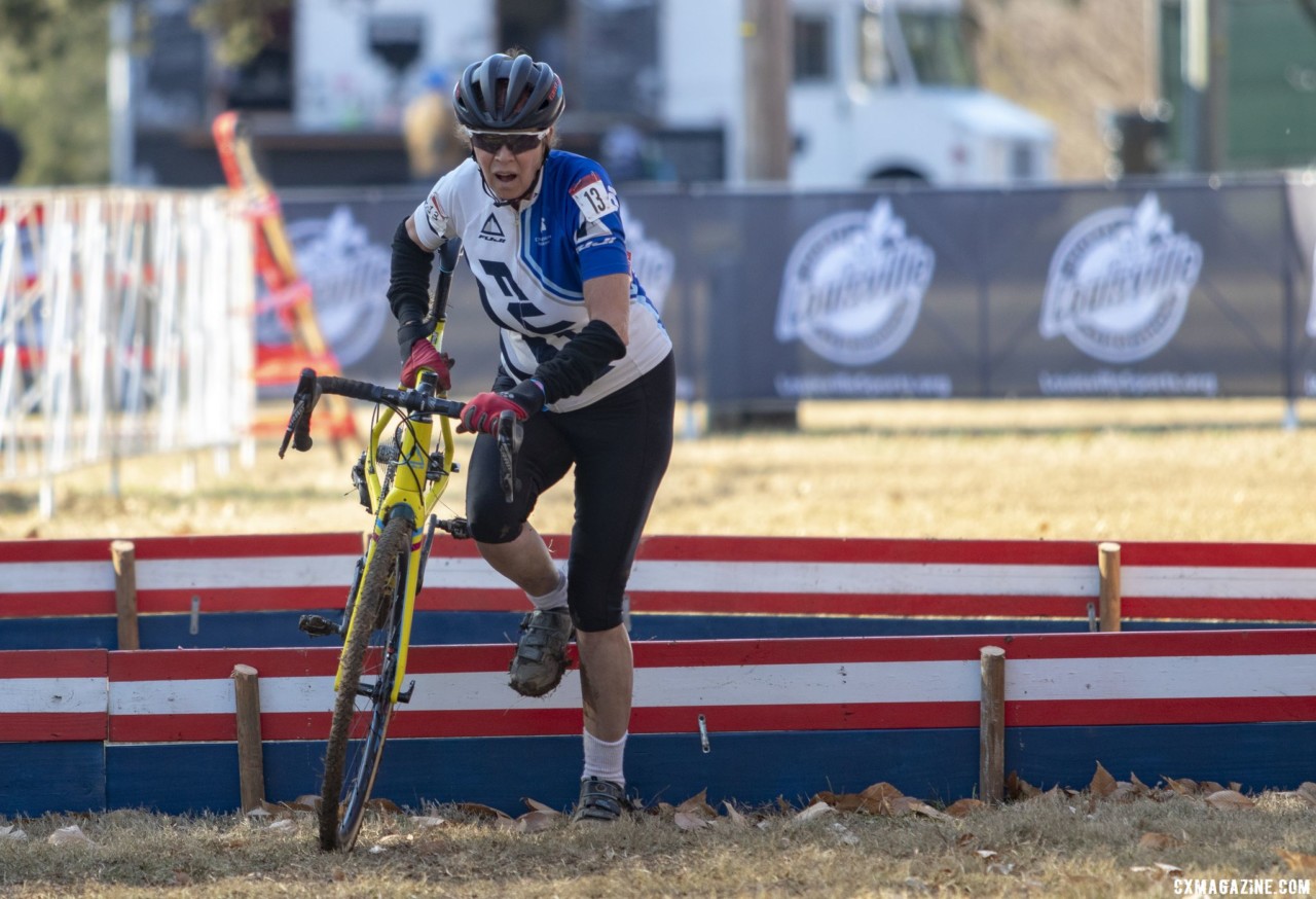 Tracy Lea runs the barriers. Masters Women 60-64, 65-69, 70-74, 75+. 2018 Cyclocross National Championships, Louisville, KY. © A. Yee / Cyclocross Magazine