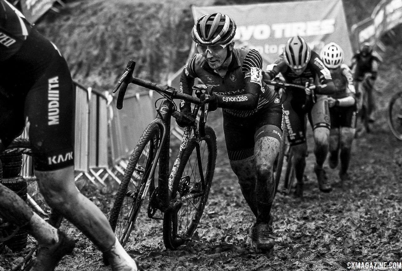 Kaitie Keough joins a line of riders pushing their bikes up a muddy incline. 2019 GP Sven Nys, Elite Women - DVV Verzekeringen Trofee. © B. Hazen / Cyclocross Magazine