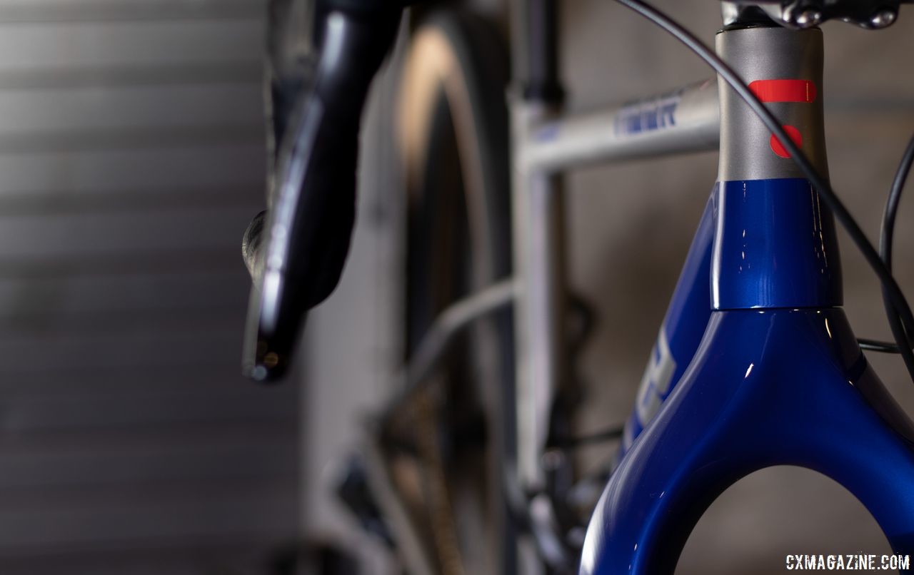 The titanium bike shown has a gray and blue paint scheme. TRed Muur titanium monster cross / gravel bike. 2019 NAHBS Sacramento. © A. Yee / Cyclocross Magazine