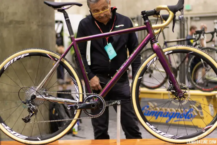 This Enigma titanium cyclocross bike with its $750 iridescent paint job caught the eye of Challenge Tire's Morgan Nichol. 2019 NAHBS Sacramento. © A. Yee / Cyclocross Magazine