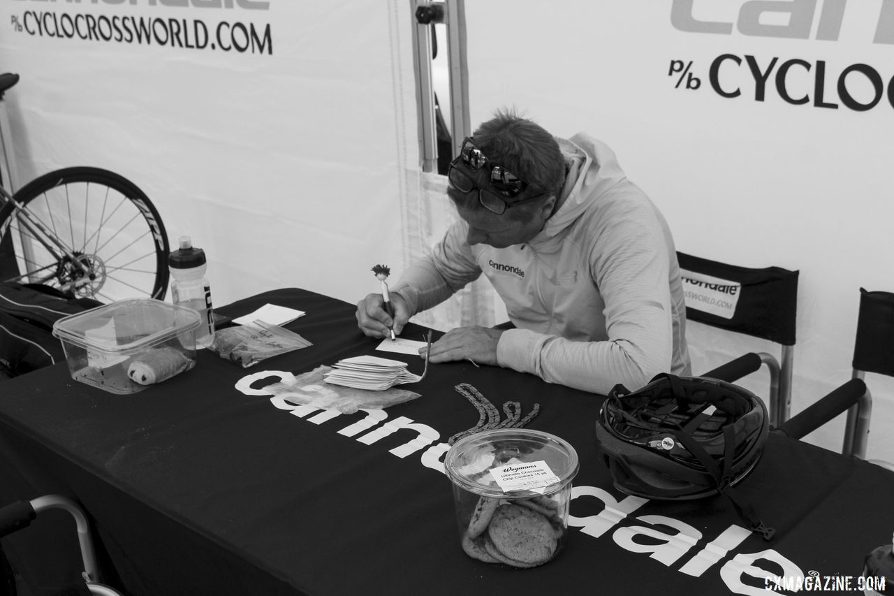 Stu Thorne of the Cannondale p/b CyclocrossWorld team takes care of some homework. 2019 Rochester Cyclocross Friday Pre-Ride. © Z. Schuster / Cyclocross Magazine