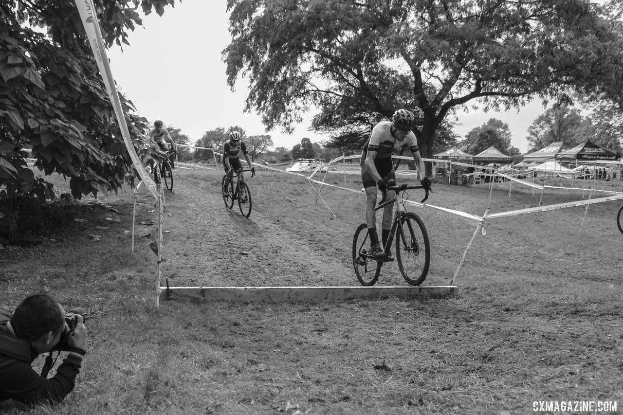 Isaac Neff leads the lead trio into the one barrier on the course. 2019 CCC Hopkins Park CX at Indian Lakes. © Z. Schuster / Cyclocross Magazine