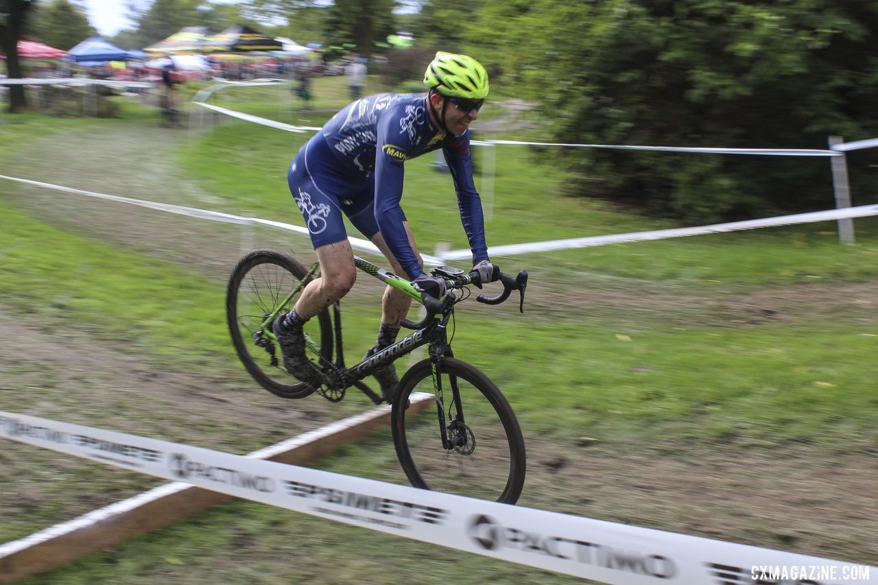 Paul Swinand hops the uphill barrier. 2019 CCC Hopkins Park CX at Indian Lakes. © Z. Schuster / Cyclocross Magazine