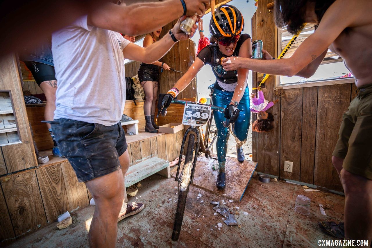 Women's second-place finisher Emily Schladach enters the chaos of the trailer. 2019 Singlespeed Cyclocross World Championships, Utah. © Jeff Vander Stucken