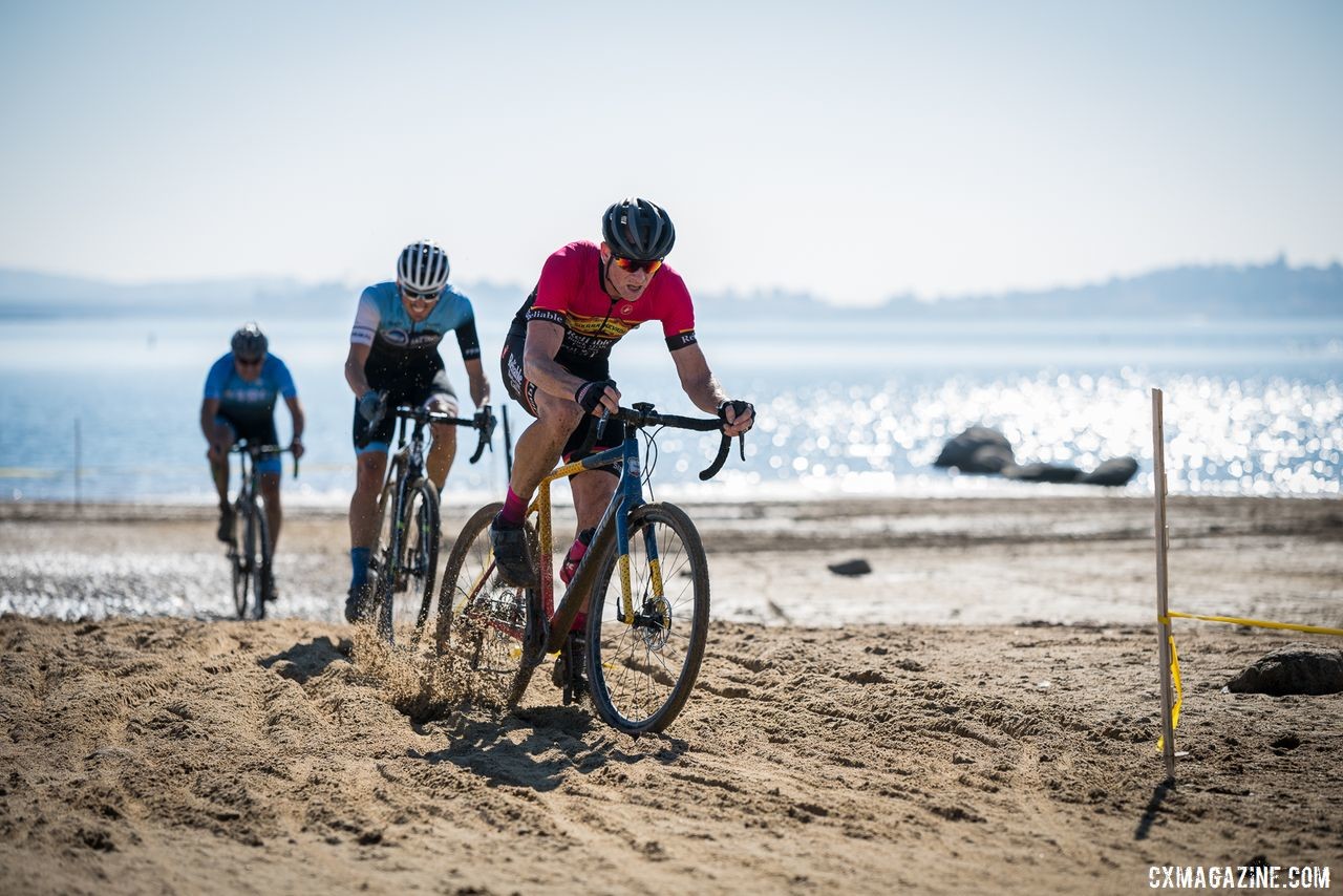 Mens A 35+ winner Ryan Odell and the lead group charge across the beach of Granite Bay. 2019 Sacramento CX Granite Beach, California. © Jeff Vander Stucken
