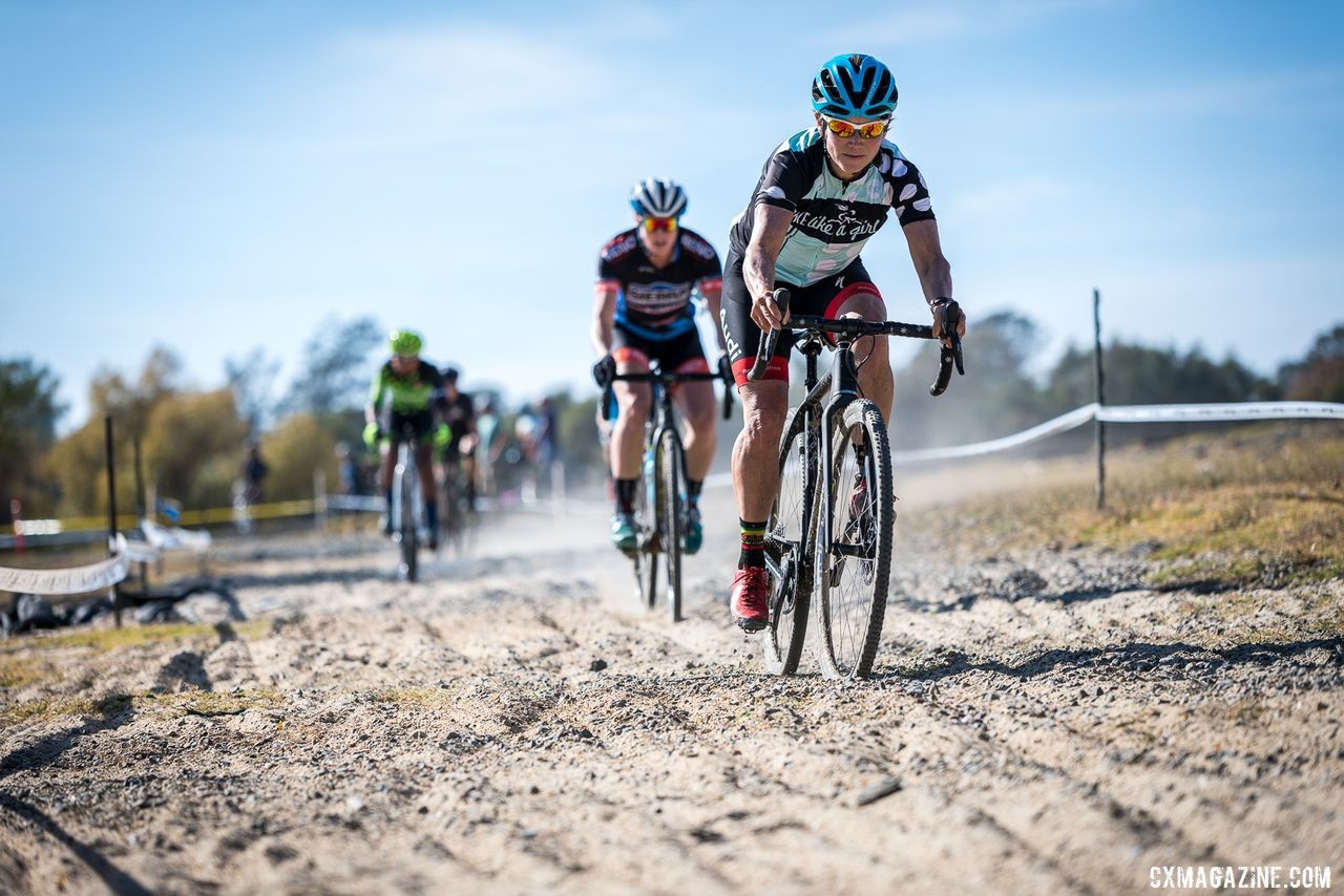 Local legend Julie Young leads out the A women on her way to the win. 2019 Sacramento CX Granite Beach, California. © Jeff Vander Stucken