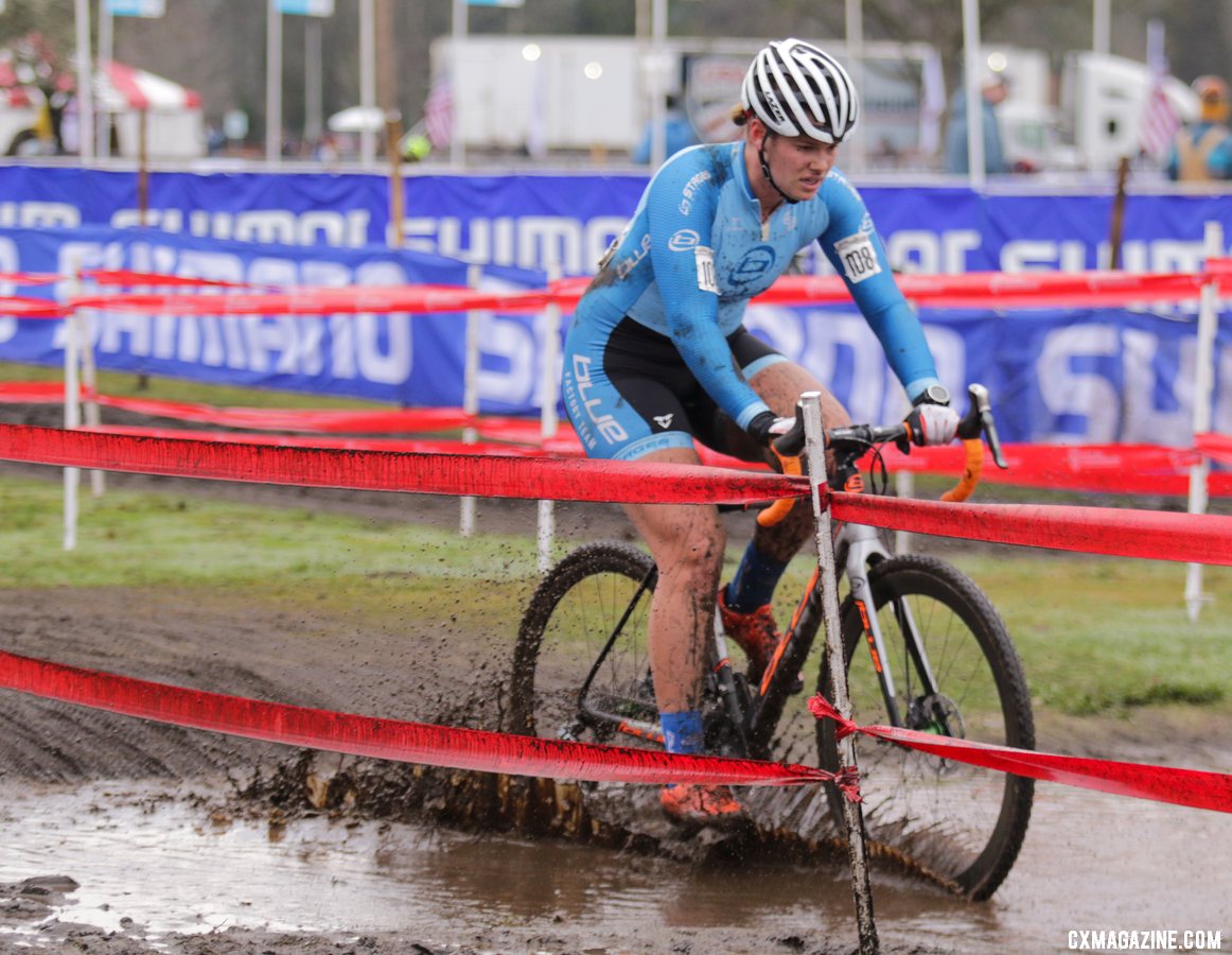 Ashley Zoerner plows through a muddy puddle on her way to a top-fifteen finish. U23 Women. 2019 Cyclocross National Championships, Lakewood, WA. © D. Mable / Cyclocross Magazine