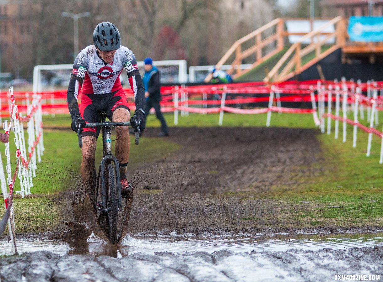 Christopher Holden splashes across a moat. Masters Men 40-44. 2019 Cyclocross National Championships, Lakewood, WA. © A. Yee / Cyclocross Magazine