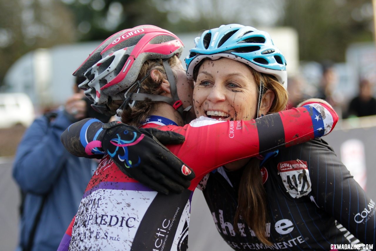 Gina Estep and Monica Lloyd embrace after their muddy battle. Masters Women 45-49. 2019 Cyclocross National Championships, Lakewood, WA. © D. Mable / Cyclocross Magazine