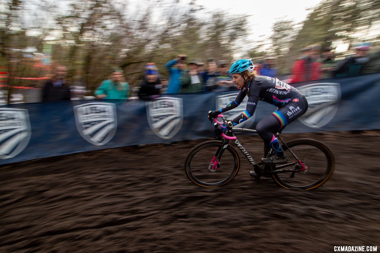 Gina Estep flys past rowdy spectators on a muddy descent. Masters Women 45-49. 2019 Cyclocross National Championships, Lakewood, WA. © A. Yee / Cyclocross Magazine