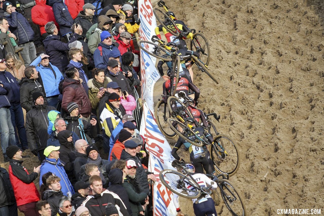 One-by-one, the lead group takes the left line up the wall. 2019 Superprestige Zonhoven. © B. Hazen / Cyclocross Magazine