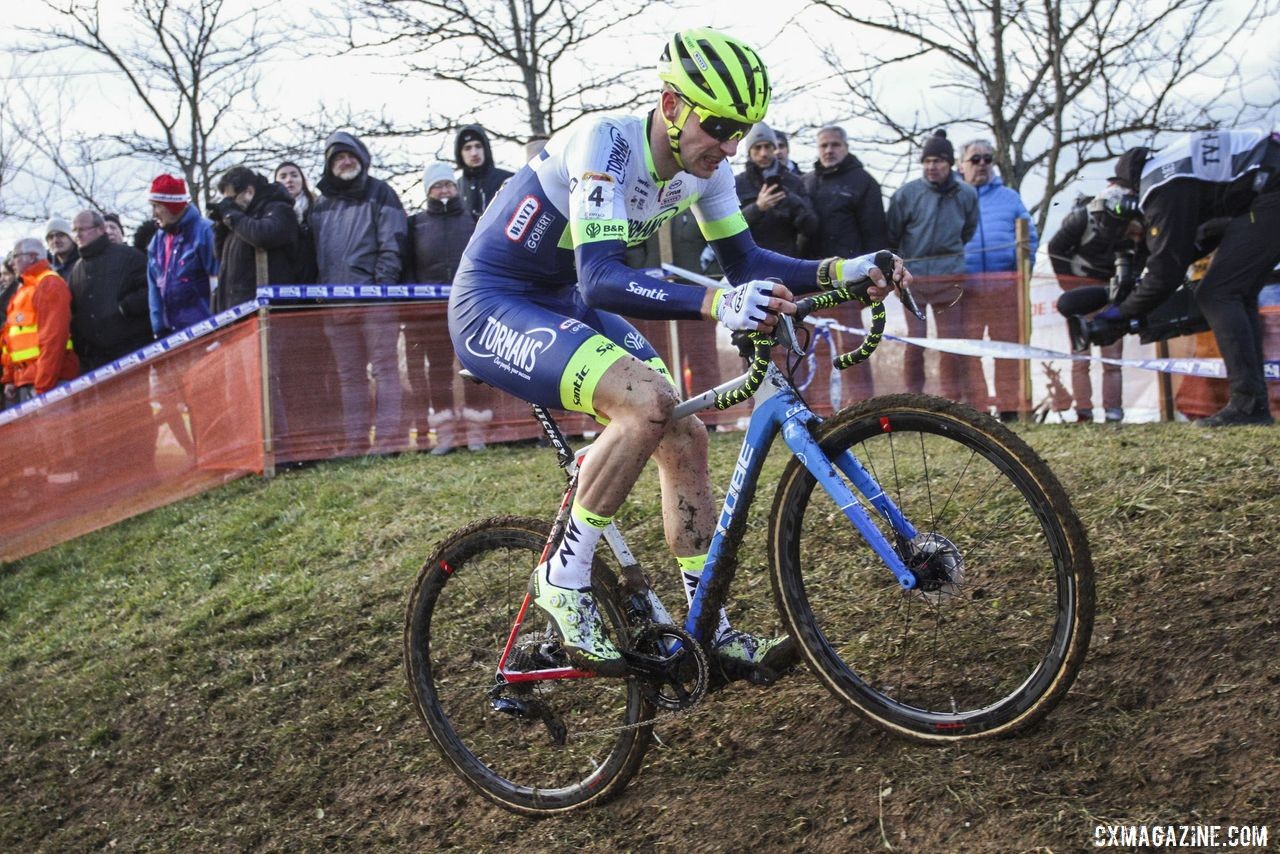 Quinten Hermans and his cube power up one of the slick hills. 2020 World Cup Nommay, France. © B. Hazen / Cyclocross Magazine
