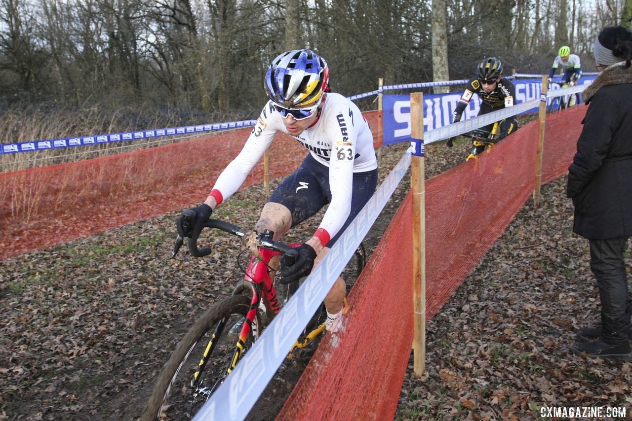 Tom Pidcock hugs the snow fencing on one of the slick corners. 2020 World Cup Nommay, France. © B. Hazen / Cyclocross Magazine