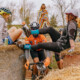 Contestants had to navigate an ever-changing maze of hay bales. 2024 SSCXWC Wisconsin - Singlespeed Cyclocross World Championships. © Mitchell Vincent